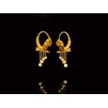A pair of exquisite neo classical gold and pearl earrings in the style of Giacinto Melillo. Each