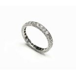 A diamond set eternity ring, ring size L 1/2.Condition report: The ring size is L 1/2. There is a