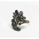 A giardinetti ring in the style of the mid 18th century with a floral design set with many