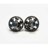 A pair of silver screw earrings set with moonstone