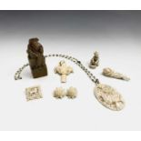 A carved ivory pendant, a netsuke other carvings and a soapstone seal