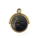 An Isle of Man copper penny 1733 in 18ct gold fob mount makers mark A.W. 21.7gm