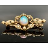 A Victorian 15ct gold brooch with central oval opal amongst pearl set foliage 40mm 5.3gm