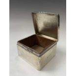 An Edwardian textured silver cigarette box by Arthur & John Zimmerman Birmingham 1904