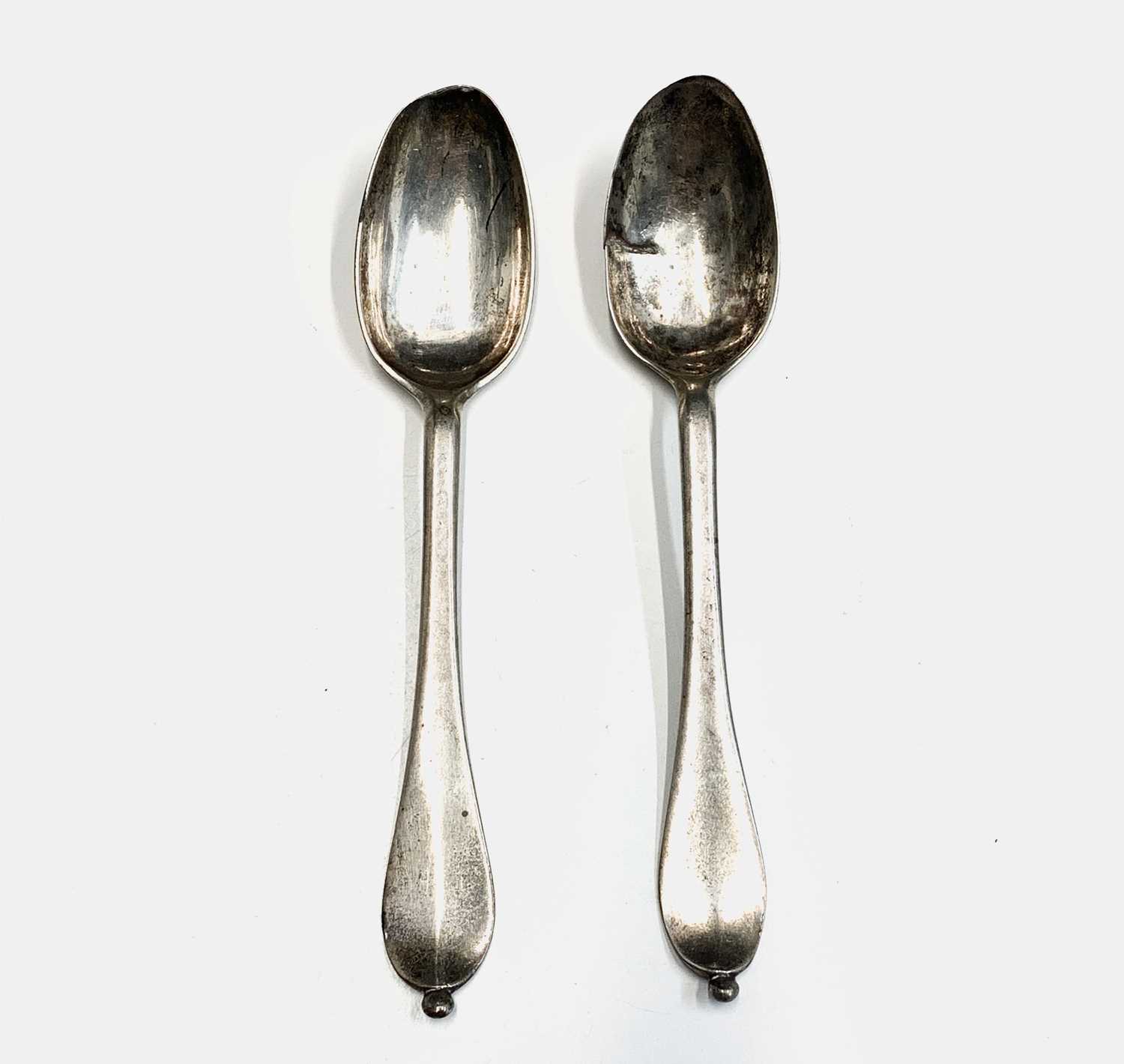 A pair of 18th-century provincial silver bead finial teaspoons crowned PS mark? 47gm