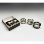 Two pairs of silver napkin rings and a fifth silver napkin ring 4.5oz