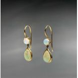 A pair of opal earrings set in gold. Purchased from Resners New Bond Street.