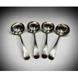 A set of four Victorian Old English pattern crested silver sauce ladles by James Wakely & Frank