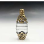 An exquisite gold caged oval cut glass scent bottle 78mmCondition report: No condition issues with