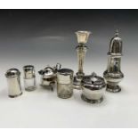 A silver vase caster 3.6oz three silver condiments 4.5oz a filled silver candlestick and two