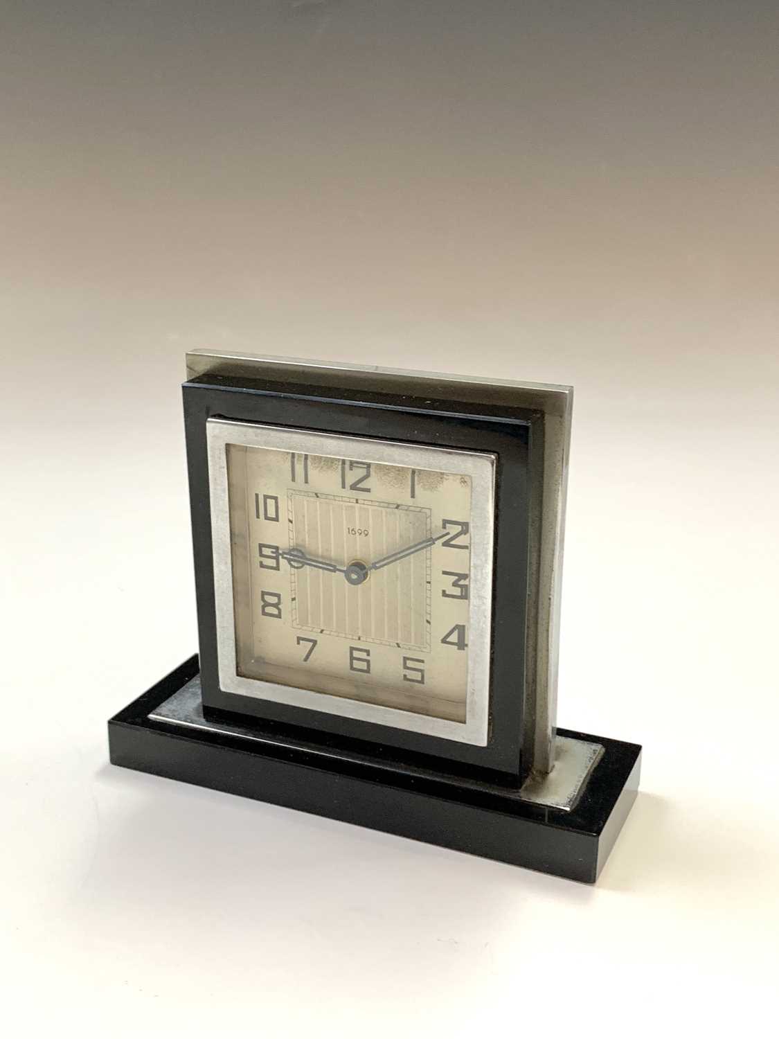 A black glass and nickel plated Art Deco clock. H: 12cm. - Image 2 of 5