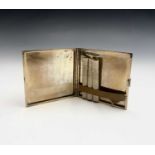 A 9ct gold cigarette case by P G Dodd, Cornhill, London with engine turned decoration and Greek