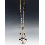 A 9ct Art Nouveau pendant set with amethyst on gold chain 6.6gm