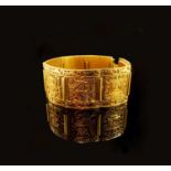 A Peruvian bracelet of seven chased panels impressed 18k and llama marks 89.2gm