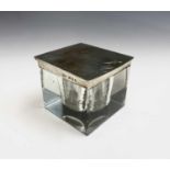 A cut square glass inkwell with heavy art deco engine-turned silver lid by Mappin & Webb Ltd