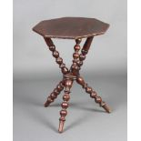 A Victorian octagonal mahogany gypsy table raised on turned supports 63cm h x 47cm w x 47cm d