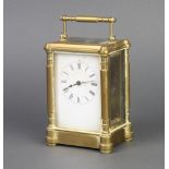 A 19th Century French 8 day carriage timepiece with enamelled dial and Roman numerals contained in a