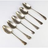 Six early Georgian silver table spoons with rubbed marks, 354 grams