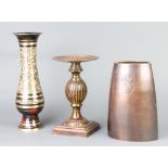 A bronze boat shaped vase of waisted form 20cm h x 8cm w x 14cm d, a bronzed finished pedestal on