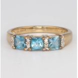 A 9ct yellow gold blue topaz and diamond ring, size O, 2.4 grams