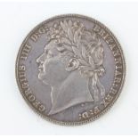 A George IV 1824 half crown, laureate head facing left, the reverse crowned and ornate garnished
