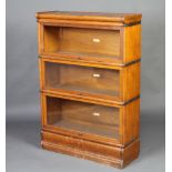 A light oak 3 tier Globe Wernicke bookcase 124cm h x 86cm w x 31cm d The top section is missing, the