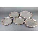 A silver plated Chippendale style salver 27cm and 4 others