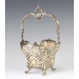 An 800 standard pierced and repousse swing handled basket raised on scroll feet, 180 grams