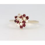 A 9ct yellow gold ruby and diamond cluster ring size M 1/2, 2.3 grams