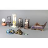 A pressed metal dolls house lavatory, wooden chaise longue, tea set etc