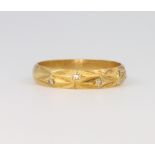 An 18ct yellow gold diamond ring, size L 1/2, 2.5 grams