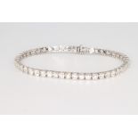 An 18ct white gold diamond set tennis bracelet, 6.34ct, 17.5cm