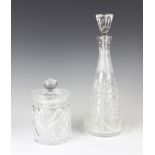 A cut glass biscuit barrel and cover and a tapered decanter and stopper