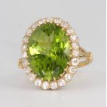 An 18ct yellow gold peridot and diamond cluster ring 20mm x 15mm, size N