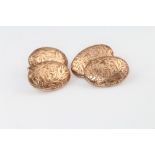 A pair of 10ct yellow gold engraved oval cufflinks 5.7 grams