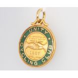 A 9ct yellow gold enamelled cycling fob - Unity Cycling Club founded 1887, 9.7 grams