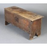 A 17th/18th Century oak coffer of panelled construction with hinged lid 45cm h x 98cm w x 35cm d