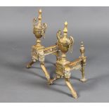 A pair of 19th Century Adam style brass fire dogs in the form of lidded urns 45cm h x 22cm w x