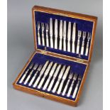 An Edwardian cased canteen of plated dessert eaters for 12 with mother of pearl handles