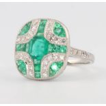 A platinum Art Deco style emerald and diamond dress ring, size L 1/2