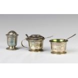 An Edwardian silver 3 piece condiment set with green glass liners, Birmingham 1911