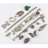 A silver charm bracelet and minor silver jewellery, 157 grams