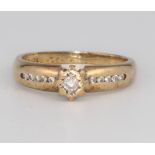 A 9ct yellow gold diamond ring, size K, 2.5 grams