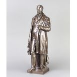 A 19th Century bronze figure of a standing George Stephenson, raised on a square base 48cm h x