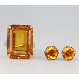 A 9ct yellow gold citrine ring size J and a pair of matching ear studs