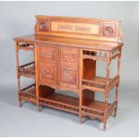 A Victorian aesthetic movement carved walnut sideboard with raised back and undertier, fitted a