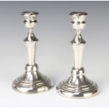 A pair of Continental tapered silver candlesticks 21cm, 415 grams