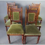 A set of 6 Edwardian carved walnut show frame dining chairs, the seats and backs upholstered in