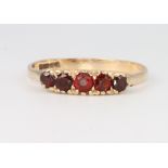 A 9ct yellow gold garnet ring size R, 1.9 grams