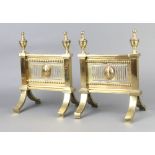 A pair of gilt metal Adam style fire dogs 27cm h x 19cm w x 14cm d